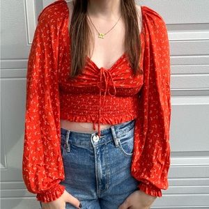orange/red urban outfitters long sleeve crop top